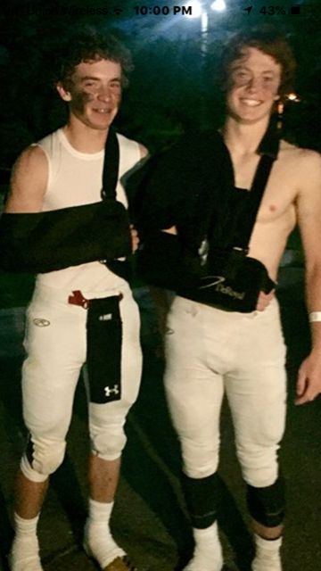 TEARS+AND+CHEERS%3A+Dean+and+Wyatt+force+a+smile+through+the+pain+after+a+rough+visit+to+the+hospital+in+Rexburg.+Both+players+broke+their+collarbones+in+the+contest.%0A