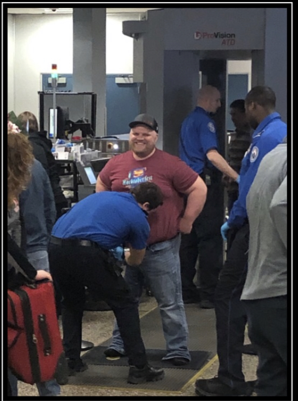 Spread+%27Em%3A+IT+tech+Mr.+Tanner+Crook+draws+attention+at+the+Orlando+airport+security+gate.+Crook+and+other+educators+from+lcsd2+recently+traveled+to+the+Sunshine+State+for+a+tech+conference.+