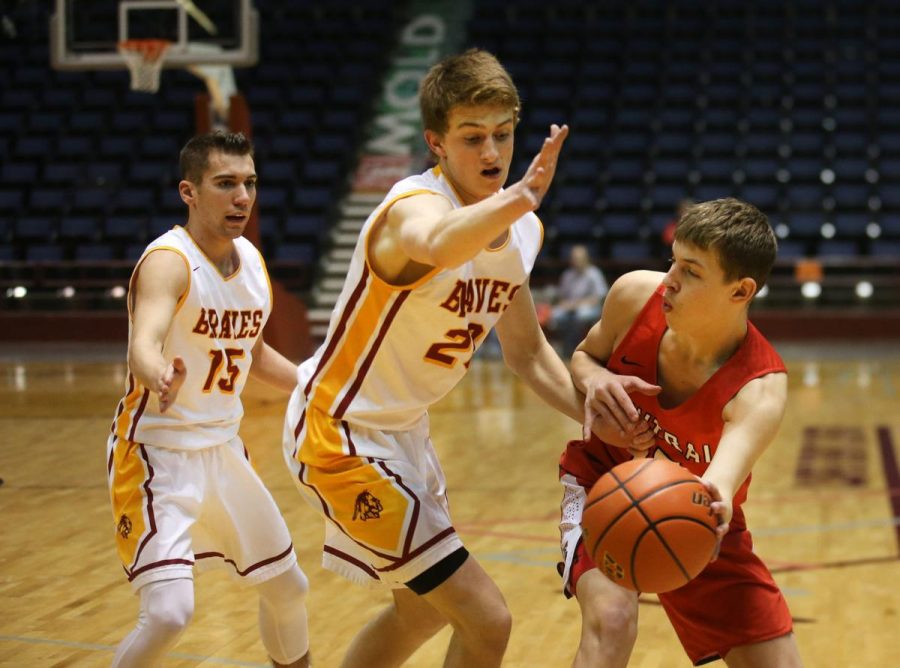 DOUBLE+TEAM%3A+Tanner+Thompson+and+Mason+Erickson+look+to+shut+down+a+Cheyenne+Central+passer+in+the+Events+Center+in+Casper%2C+WY+at+the+state+tournament.+Photo+by+Jacob+Byk%2FWY+Tribune+Eagle.+