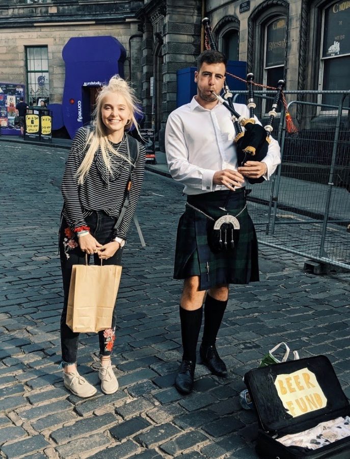 STREET PIPES: Emma Graham approaches a genuine bagpiper on the streets of Edinburgh, Scotland. She spent a large part of her summer break living with and working for a host family in the country. 