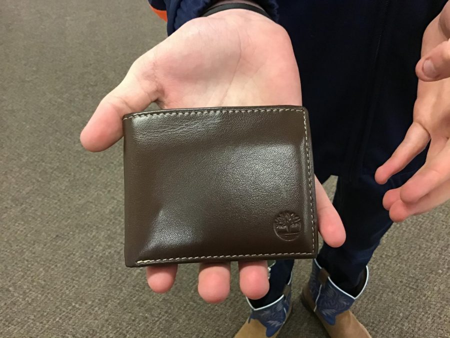 PAID: Two of the most popular wallet colors are brown and black. Bradyn Jenkins received a very nice brown, leather wallet for Christmas. Wallets can hold cash and change as well as personal items. "It makes it easier to carry cards,"  said Jenkins.