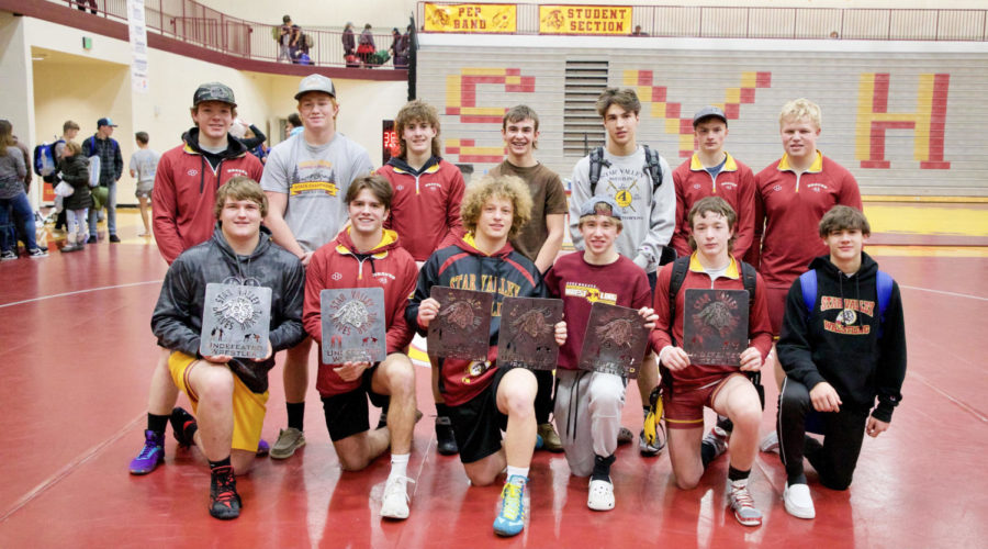 WORKING HARD! Five Braves went undefeated at the Brawl. It can be somewhat intimidating wrestling varsity as a freshman, but felt good to start the season undefeated, said freshman Cooper Berk (far right).