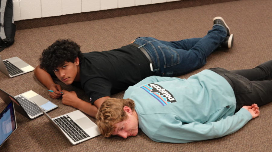 NAP TIME: Juniors Jacob Hodges and Nate Hughes  take a much-needed break after working on their English projects. English stressed me out because my teacher let me play Shell Shockers all semester, so now I have a bunch of missing assignments I need to do before Christmas break, said Jacob Hodges.
