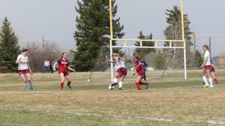 GOAL+DRIVEN%3A+Senior+Sharon+England+takes+the+ball+past+an+Evanston+defender+to+the+net.+England+recently+signed+to+play+soccer+at+Western+Wyoming+Community+College.
