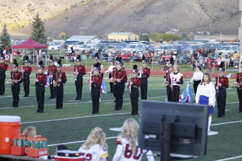 SHOWTIME: The band performs at halftime during the homecoming game after getting a late start.
