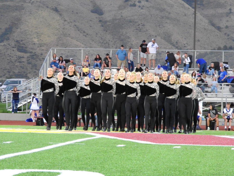 KEEP+STEPPIN%3A+The+Brave+Cadettes+take+the+field+during+halftime.+Three+seniors+dance+on+the+team.+