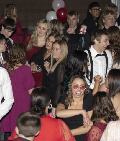 SIDE EYE: Freshman Italy Erickson checks out her classmates dance moves. The dance was really fun; the energy was definitely there, Erickson said.