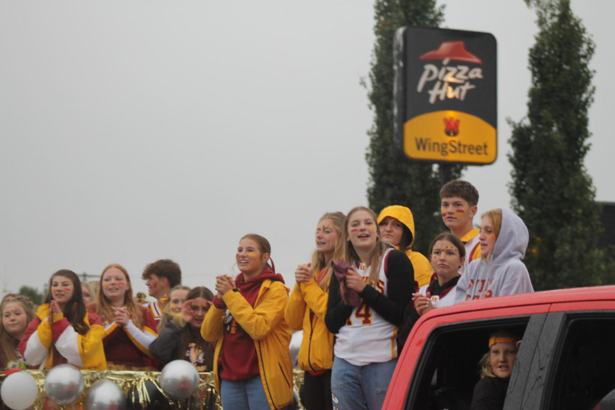 One of the after school activities includes cheer. These are the cheerleaders on the float that they had for homecoming for the parade. 
