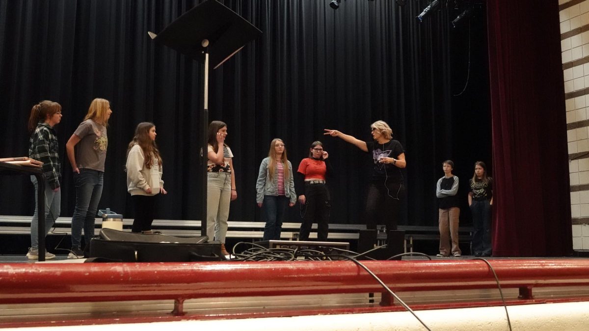 HEY GUYS: Production director Tammy Nielson works with some of her Guys and Dolls cast during the preliminary stages of getting the musical ready for the stage in March. 
