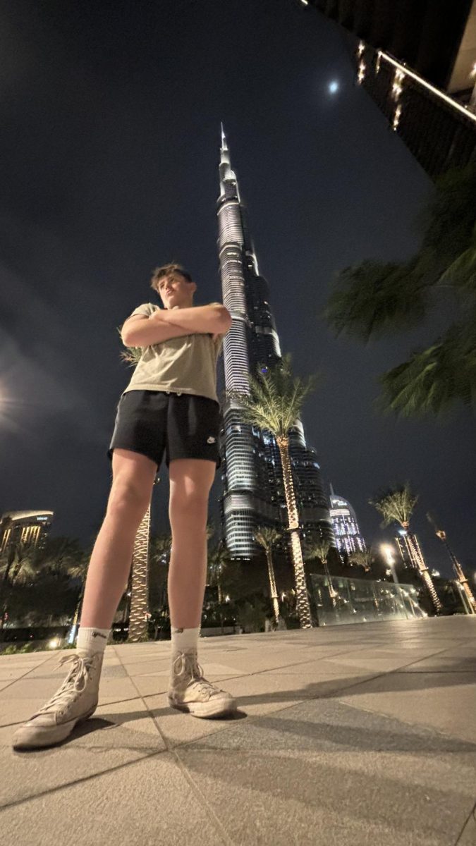 MESURE UP: It would take 453 of me, stack foot to head, to reach the top of the Burj Khalifa standing at 2,716.5 feet and shown lit up at night. (dont look too closely, Ive been skipping leg day)