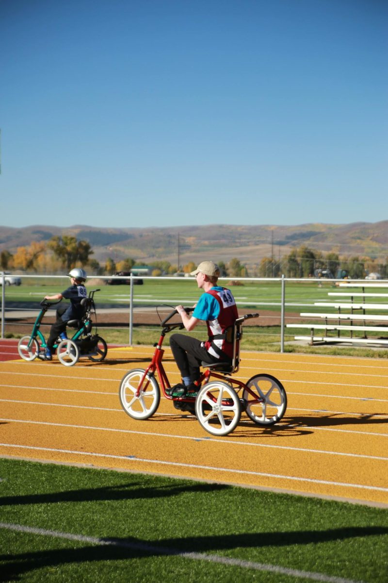 PHOTO FINISH: Bradford races towards the finish line on his bike. The athletes seemed to like the bike races the best of any event. 