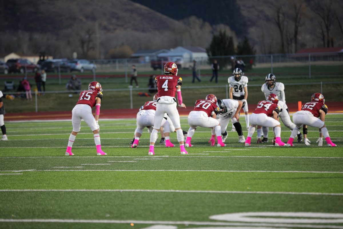 DOWN, SET, HUT! Senior Smith McClure gets the line set and ready to go. Mcclure went 25/29, 278 yards and 5 touchdown passes on senior night against Green River. McClure said, "The boys on the line are a big part of why we're successful." 