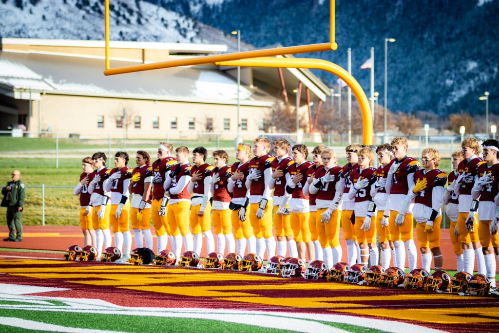 PLAY BALL! The Braves line up to listen to the national anthem prior to their first home playoff game against Lander. "This is when everyone locks in," said Soph Beckham Brog. The Braves would go on to beat Lander 52-0 and will face Riverton Next. 