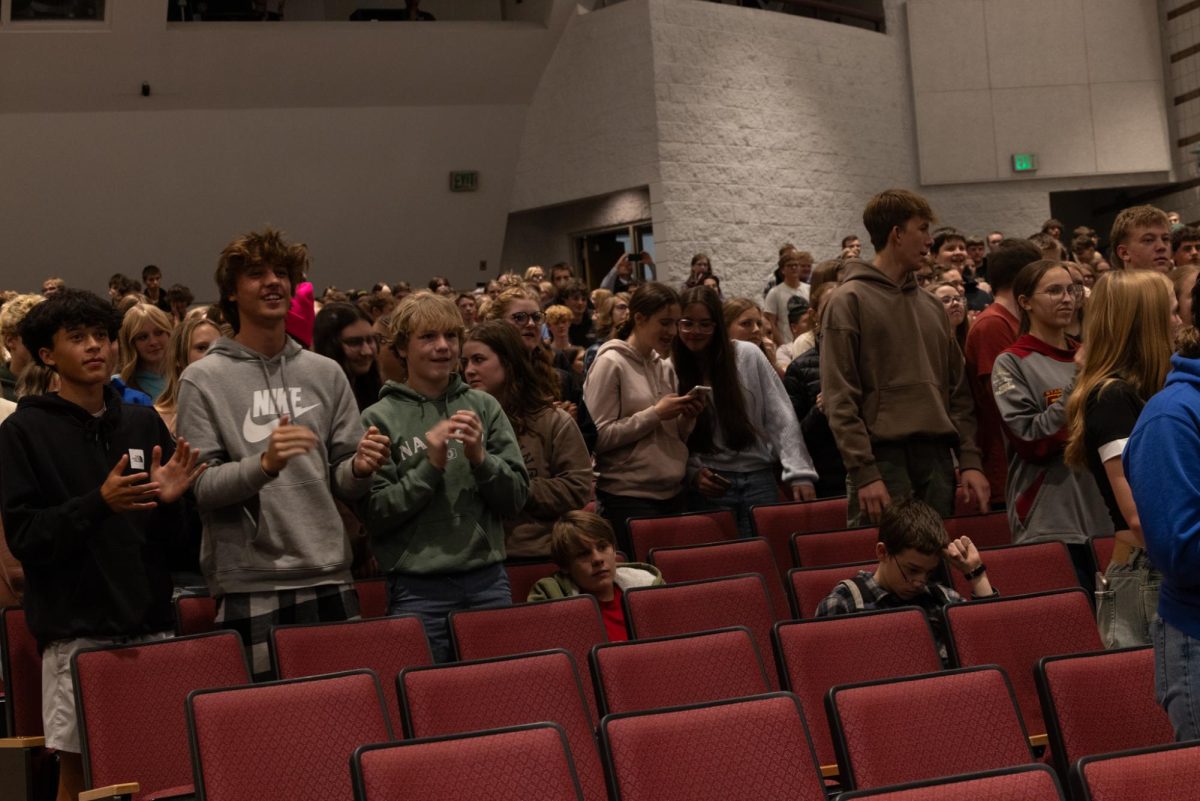 KIND OF: Students clap along to the band Telehope during the school-wide kindness assembly.