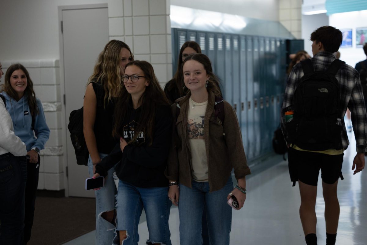 SHOULDER TO SHOULDER: Buds Jillian Jackson and Mylie Webb find comfort in companionship on their way to class. 