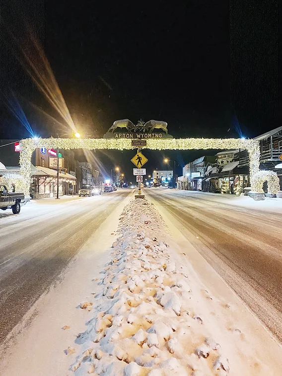 Afton's main street is divided by plowed snow. This burm can reach over four feet in height on heavy snow days. Snowy conditions can lead to dangerous and slow commutes to school each day.