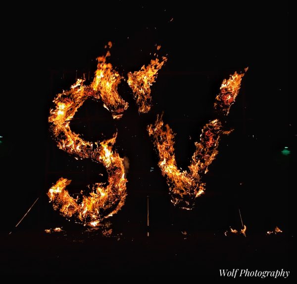 The SV burns on Homecoming eve right after the powder puff game. Everyone gathers around this annual tradition to watch it light up and bring good luck to the Homecoming game.  “I think extracurriculars boost school spirit because it brings kids together through something that they enjoy!” said Nathen Haderlie.
