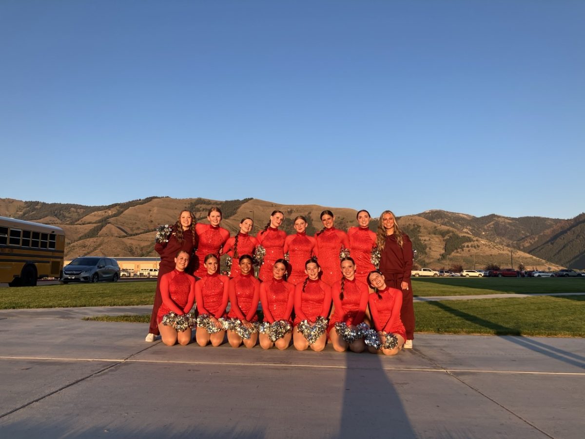 The Brave Cadettes pose for a picture before going out to perform for the whole community. They take a picture like this before every performance. After the picture they do cheers to calm their nerves like shaking at their arms and legs. Senior Jacy England said, "This is one of my favorite things to do before performing. It's crazy to see how much you grow throughout your four years of high school."