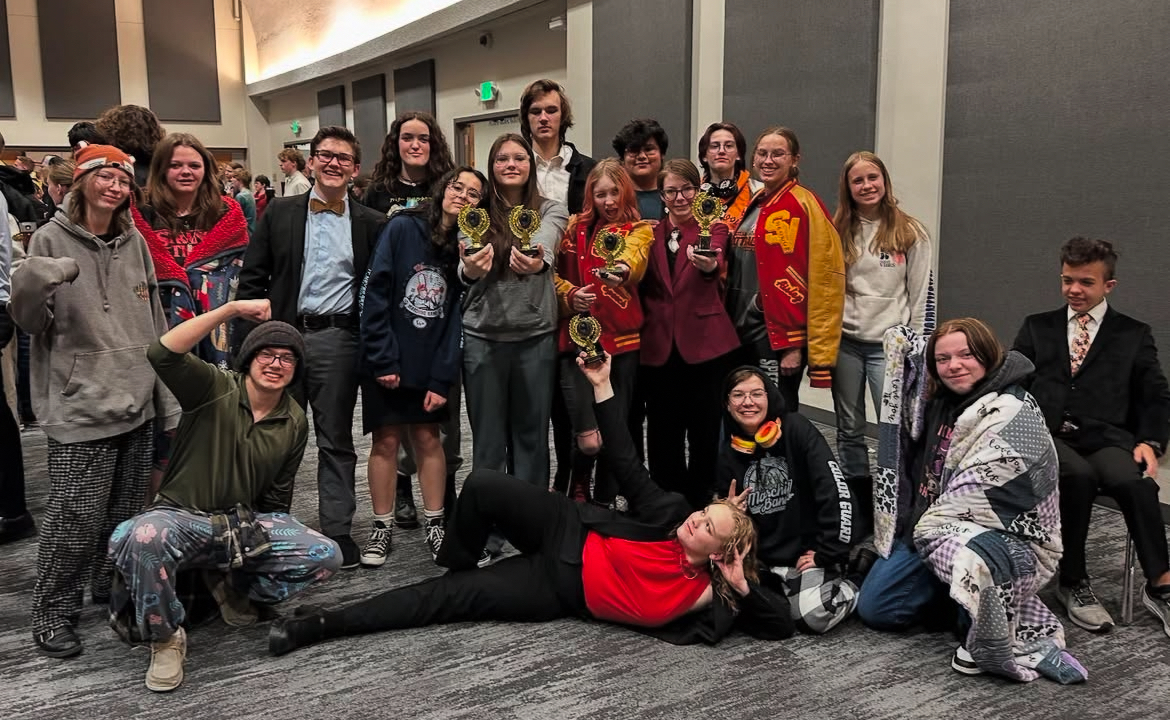 The Speech and Debate team poses for a photo at the end of the ISU awards ceremony. Five students received awards for their accomplishments at the tournament. Junior Marie Bateman said, "Getting third helps motivate me to work even harder to hopefully get higher in future tournaments."