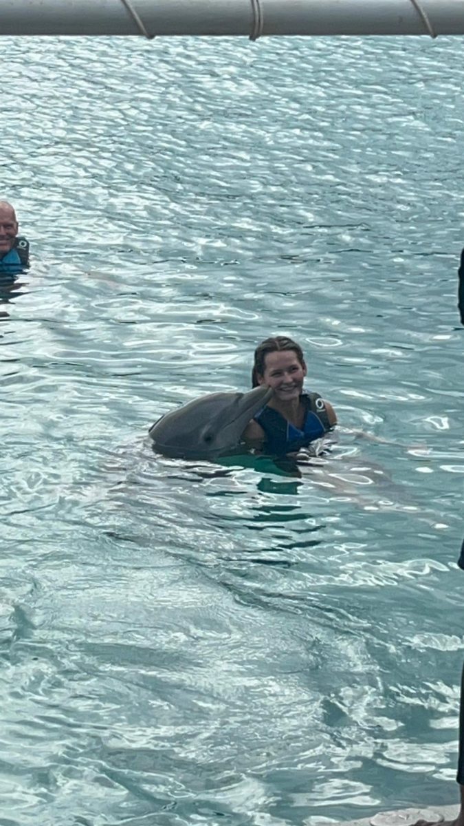 Presley Frome finds some new ocean friends on a Christmas family trip. She and her family went to the Bahamas. She said, "My favorite part of the entire trip was swimming with the dolphins."