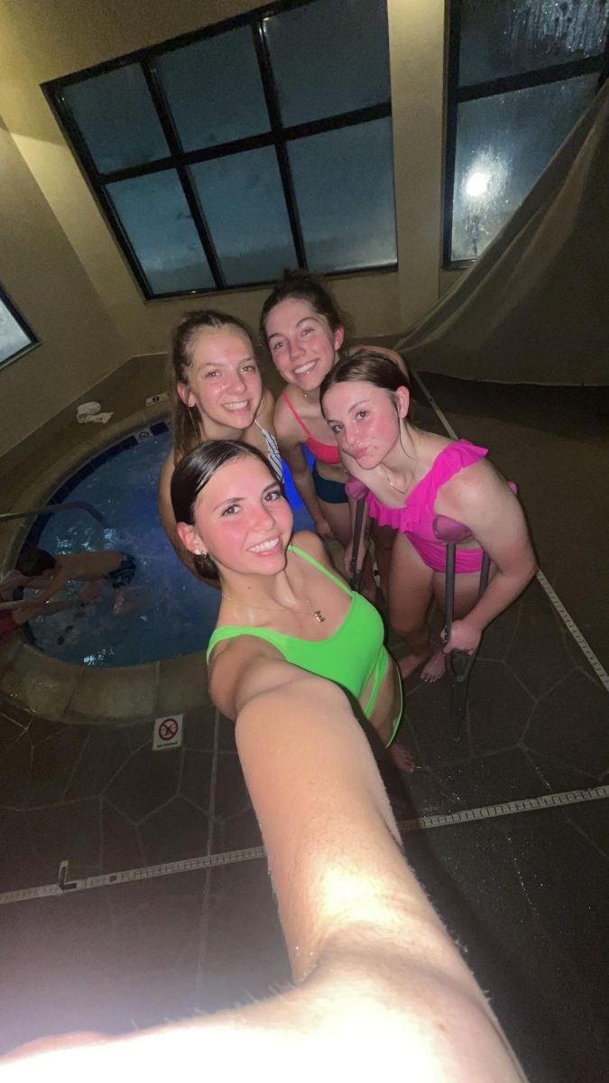 Pool party! Seniors Emily Dana, Tori White, Makell Haderlie, and Austyn Bagley have fun at the pool celebrating their win. "It helps our dynamic because we are so close to each other off the court. These girls are so fun to be around," said White.