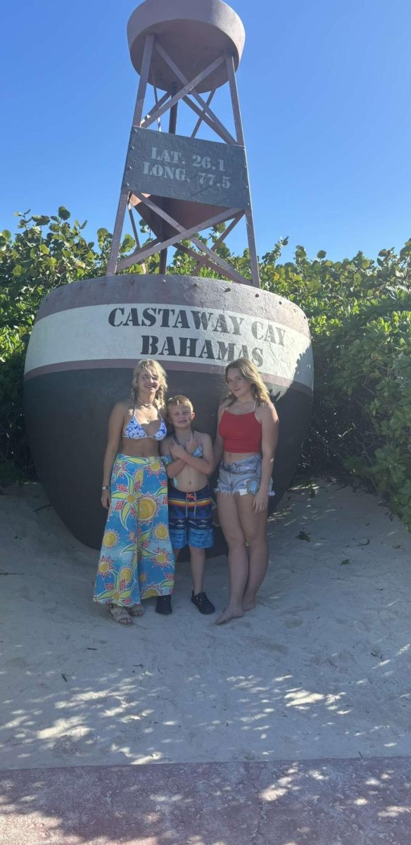 Sisters freshman Brinley Merritt and junior Rylynne Merritt with their little brother on their family vacation over the break. They went on a Disney cruise. “My favorite thing was definitely having weather in the high 80’s in the middle of December,” said Rylynne.