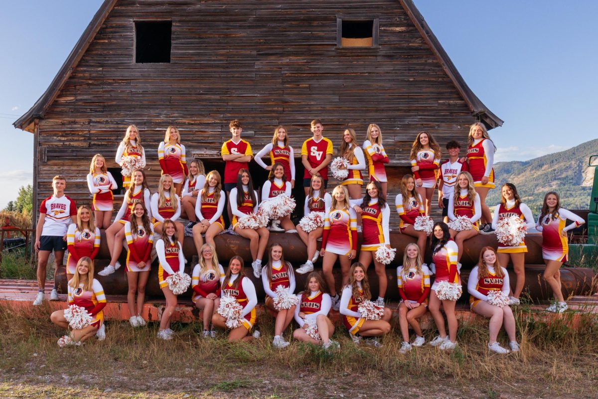 The 2024-2025 regular season cheer team positions together in front of barn for their team pictures. These pictures were actually taken on pipes used for farming equipment, and all photos this day were done on a real farm, giving their pictures a more Star Valley feel. Sophomore Cheerleader Joyah Schreiber said, "I really enjoyed these pictures. I loved that they had a more fun look than being super uniform."