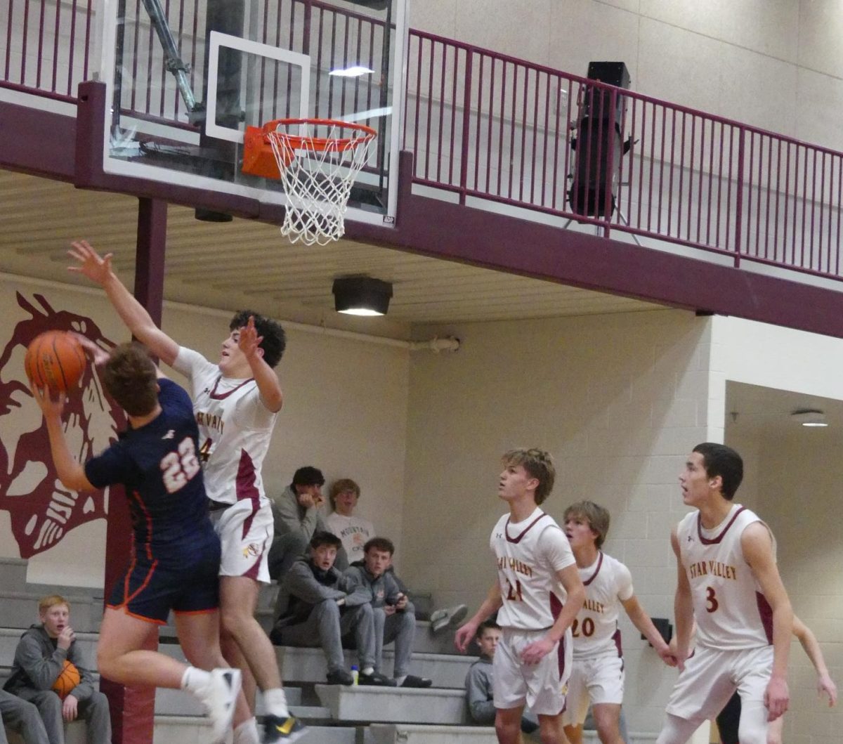 COVERED: Sophomore Travis Thompson smothers a Mustang. Mountain Crest was the JV Braves first home opponent of the season. "We came out of the weekend with many different goals and are ready for this weekend," said sophomore CJ Neuenschwander.