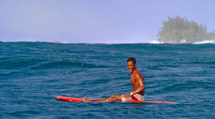 Eddie Aikau surfing the waves of Sunset beach in Oahu 