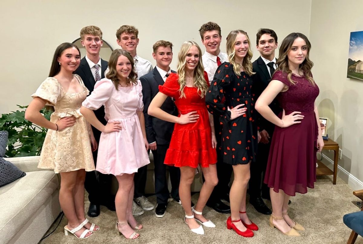 This big date group assembles for the first time on Feb 8th before heading to the dance. Some groups like this one did not go on a day date but got together for dinner before the dance. Sophomore Maddie Aullman said, "I thought the dance was fire. Most of our plans were last minutes, but at the end of the day our group was amazing, and we made some good memories!" They at dinner at Jace Burton's house.