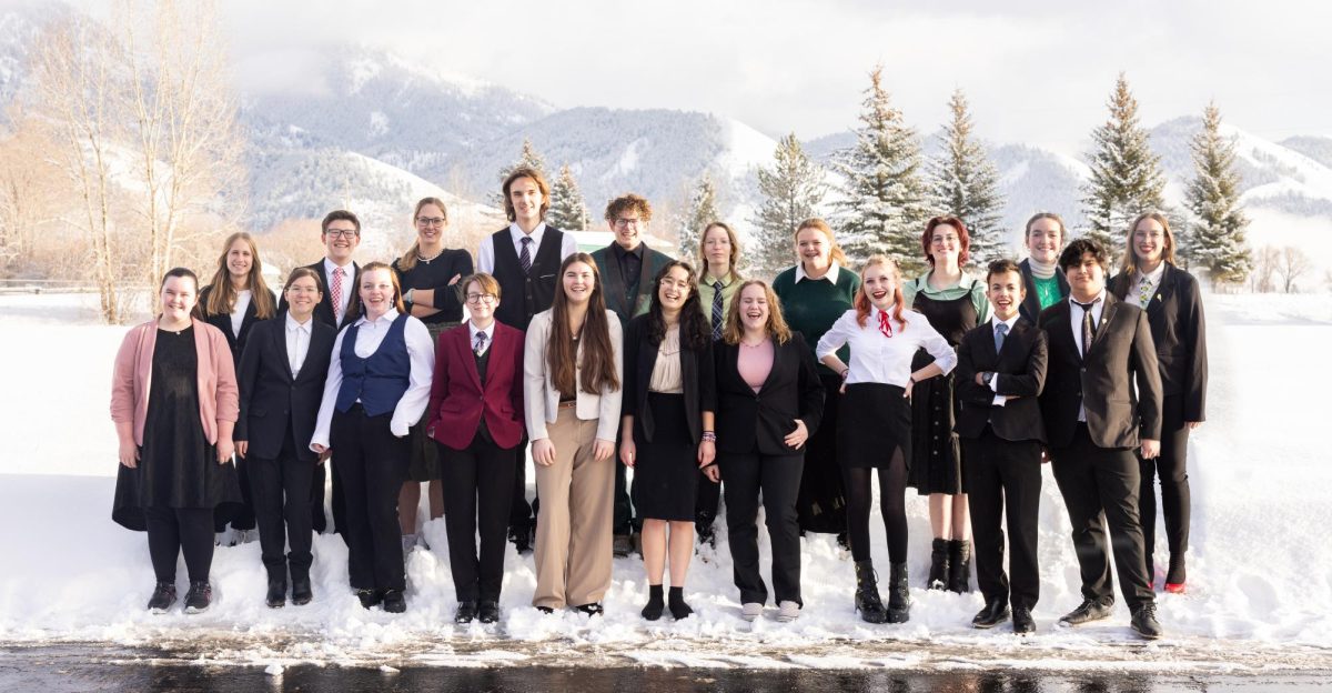 The girls and boys of Speech & Debate take a group photo in the cold weather outside of Star Valley High School. The team ended up editing a picture of the speech & debate "ancestors" that comes from their iconic theme "Lets talk it to death." Sophomore Bailey Sperry said, "I am so happy I beat my biggest competition at our recent tournament!" 