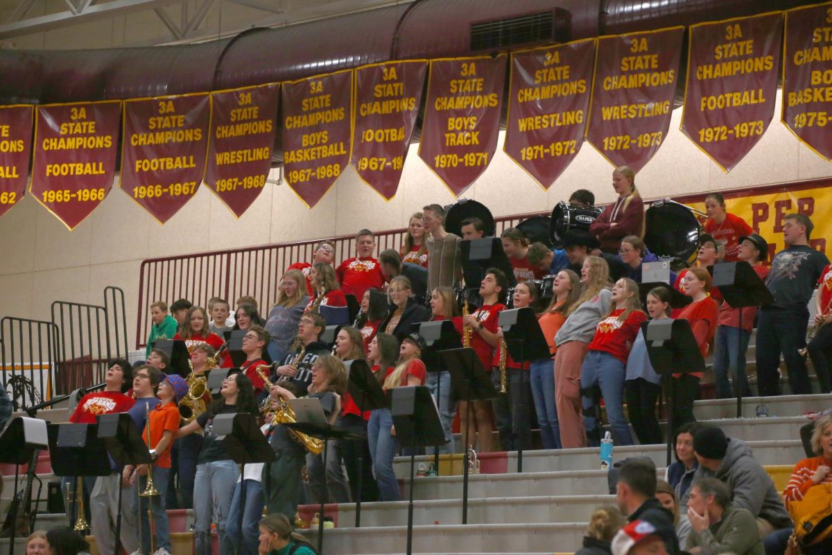 The pep band joins the cheer team in the  "Pump It up Cheer" at a girls basketball team. The band members always try to join in on cheers as long as they're respectful to the coaches and the other team and often perform their own cheers. As freshman Stryker Suter said, "I always enjoy joining in on the cheers at games; they always bring a good vibe to the place."