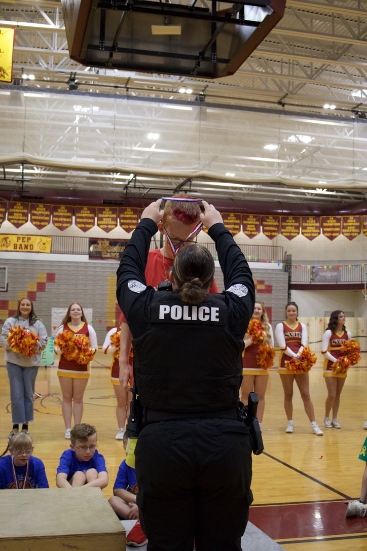 Jade Waldron accepts his reward after swishing all of his shots! A few months earlier, Waldron participated and achieved at the fall Special Olympics. he had won awards at fall olympics. Jade's dad Mr. Waldron said, "Jades been talking about the cheerleaders helping all week. Thank you so much for doing this for them!"