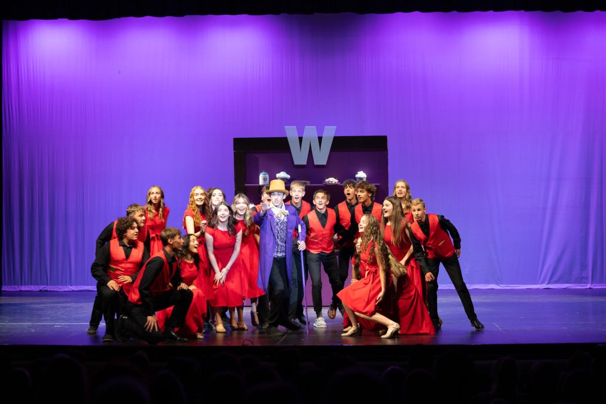The Candyman Can! Singcopation member gather around Will Wonka during the opening number of their two-hour show. 