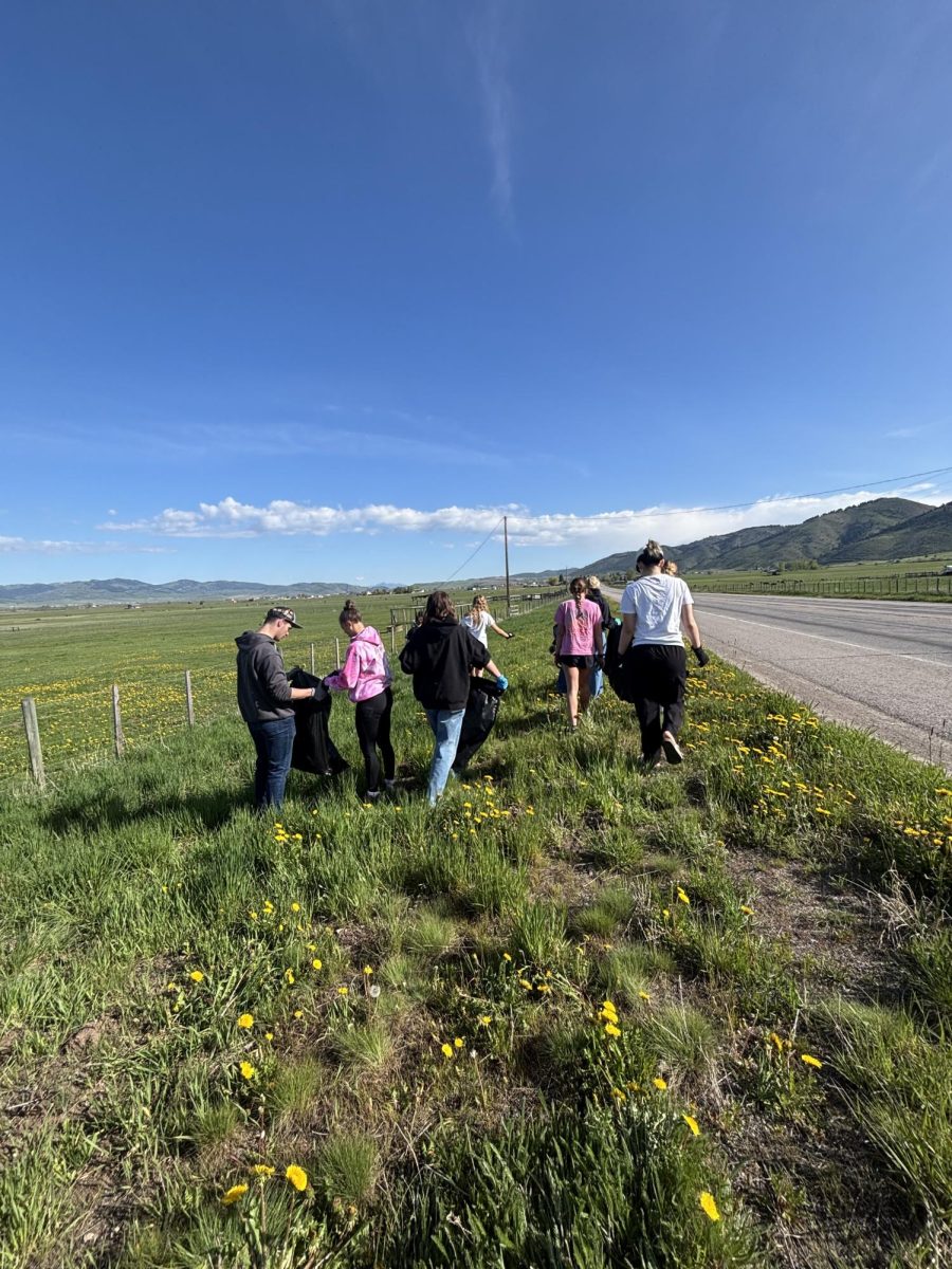 The 25-26 cheer team gathers on the highway to cleanup trash. The day before this they had their first practice. "I am so excited I get to experience this with my time here," exclaimed South Korean exchance student Ahrin Kim. 