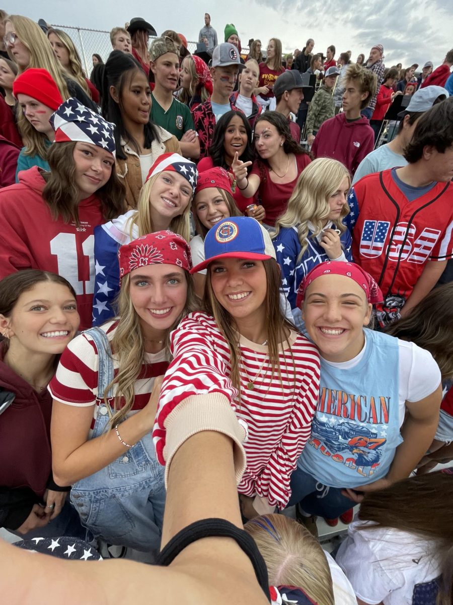 A group of fans take a picture before the Braves came back with the W! This was the first home under the Friday night lights! Ruby Gaskell, who took the picture, said, "I love home football games for the school spirt and being with my friends in the student section." Gaskell has a brother on the team and loves to support him.
