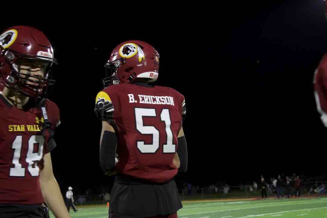 Junior Bryce Erickson and sophomore Paxton Holland wait for the next play to begin. Erickson played a big role in the win vs Cody where he had the game winning sack that sealed the win for Star Valley. Erickson said, "You never know how a game is going to go, so I just try to always be ready, and when I get to play, I just try to get 'em."