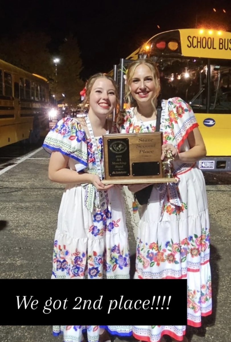 Drum Majors, Molly Roberts and Jocelyn Burgess pose in Casper before boarding the bus back to SV.