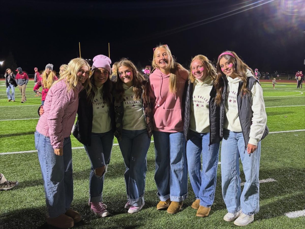 After home football game against Evanston the managers gather for a picture. Last year there were 3 managers and this year they have doubled that. Sophomore Lila Kinder said, "I had a great time hanging out with all of the managers; it felt like a real family."