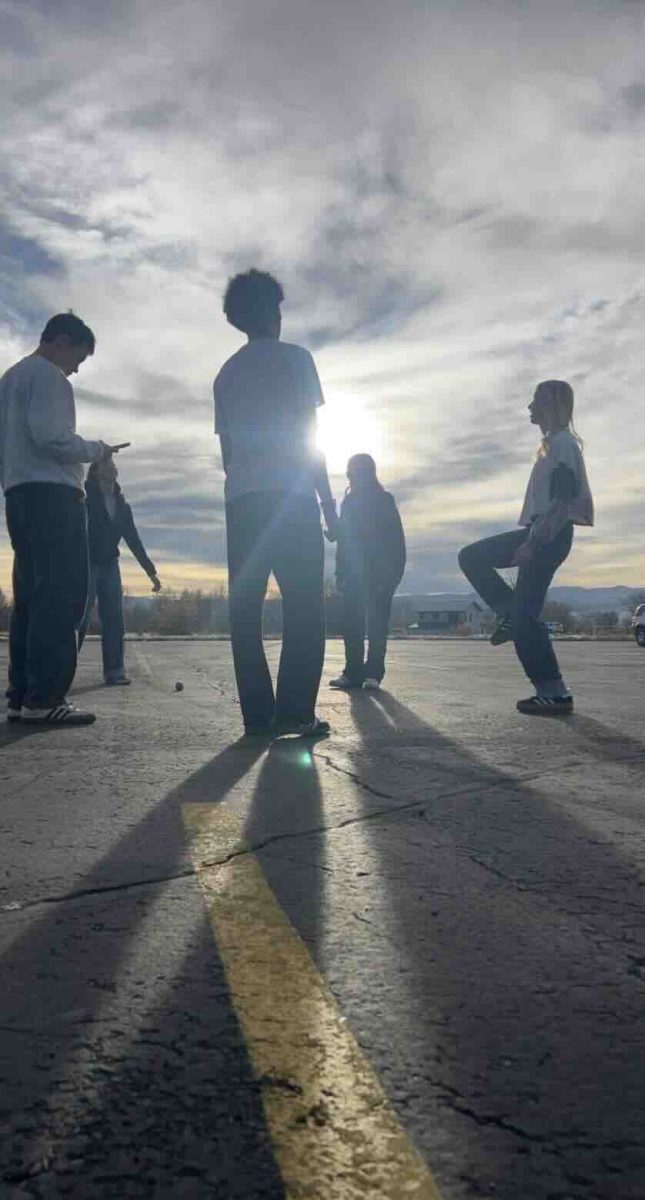 The afternoon sun sets the perfect vibe as students Rachel Smith, Brooks Jenkins, Zorian Richardson, and Camryn Hansen join friends for a few rounds of hacky sack in the parking lot. Laughter, quick reflexes, and friendly competition fill the air as the group keeps the sack in play. “It’s the best way to end the school day,” said Jenkins, as the circle grows with every kick. Sometimes, the simplest games bring the biggest smiles.