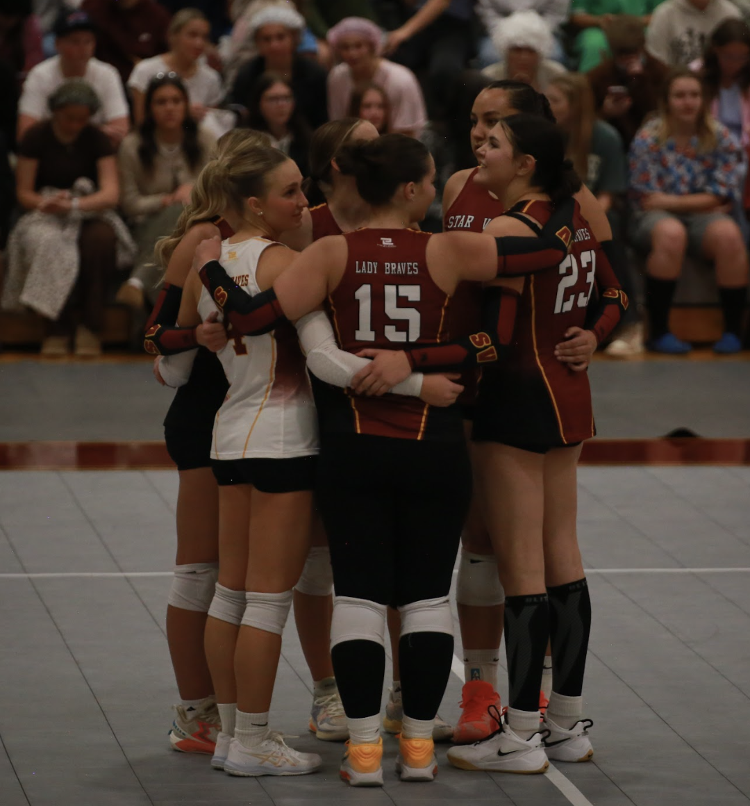  The Lady Braves huddle up during a timeout. The team finished 3rd at regional in Casper giving them confidence going into the state tournament.  "Going into state knowing we can play that good and be able to stick with all the other teams is such a confidence booster," said senior Braxtin Ware.