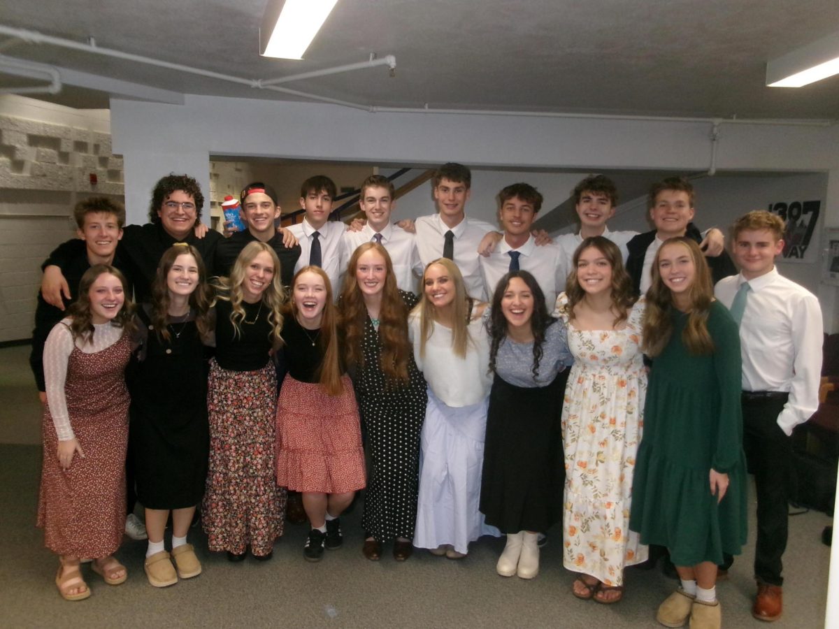 Singcopation gathers together in their concert attire to capture the moment before singing on stage. Singcopation’s first time singing together since the start of the new trimester. Senior Ainsley Bowman said, “It was so fun to be able to spend time together as Singco! I love them all so much and wanted to make sure to capture this memory with my digital camera!”