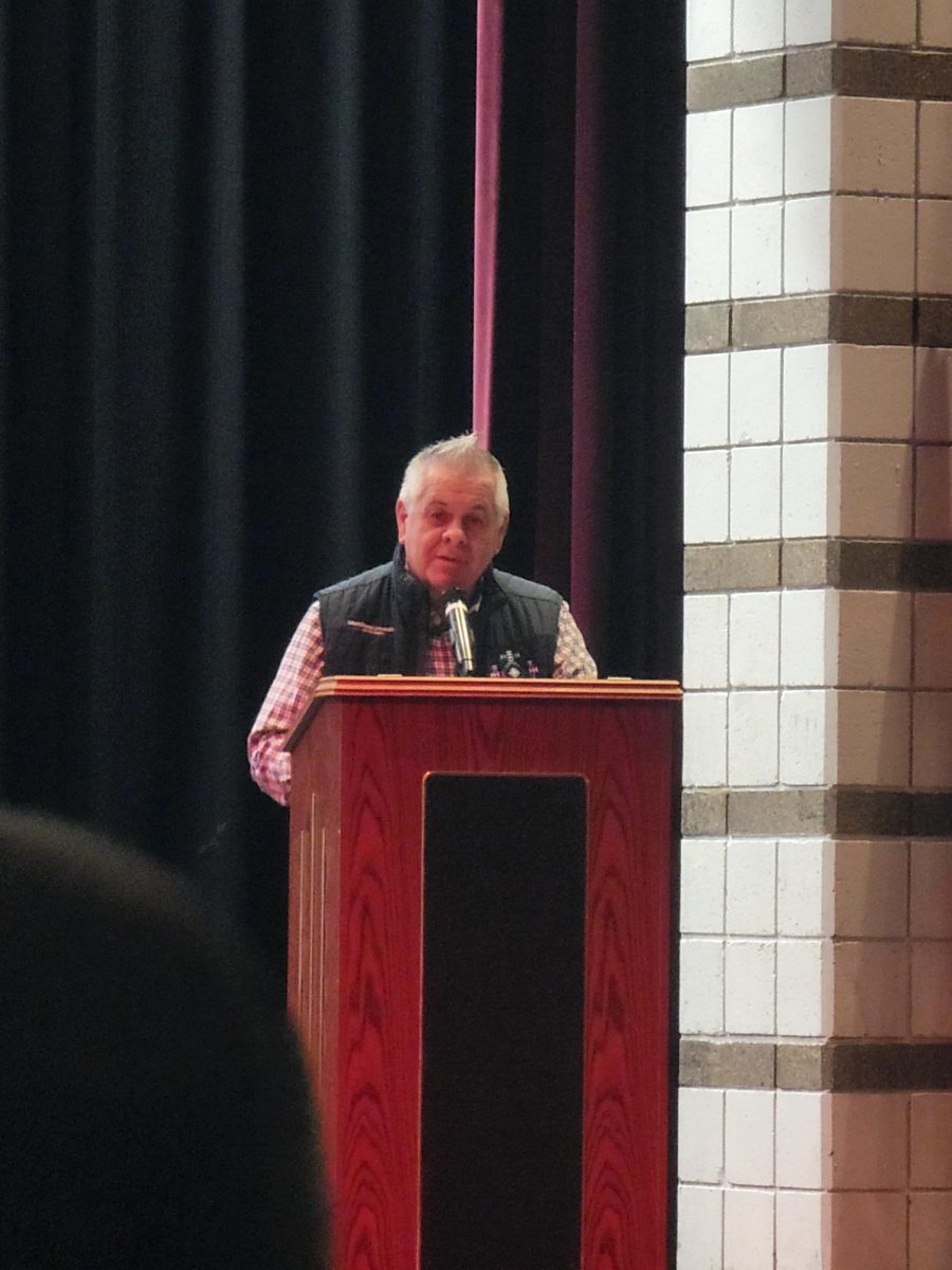 Darren Parry speaks to juniors in the auditorium during a Nov 21 assembly. The former chairman of the Northwestern Band of the Shoshone Nation teaches Native American History at Utah State University 