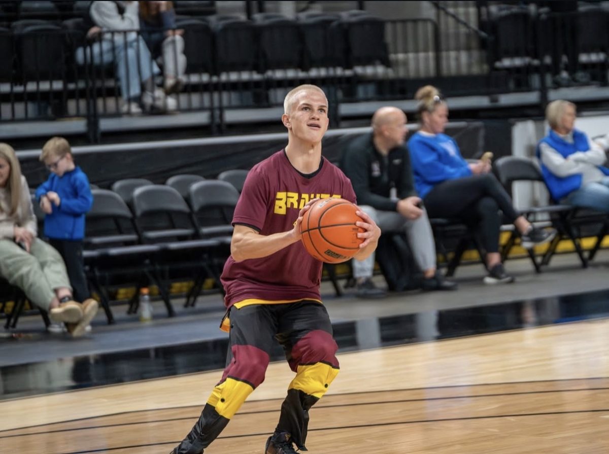 Star Valley junior Gabe Delgado lines up a shot during pregame warmups ahead of the Braves’ season opener. This year marks the first season the Braves are wearing new tear-away warmup pants, adding a fresh look to game day. Delgado shared his thoughts on the new style, saying, “I think the pants look really drippy and give us aura.” Photo by Titleone Tip Off