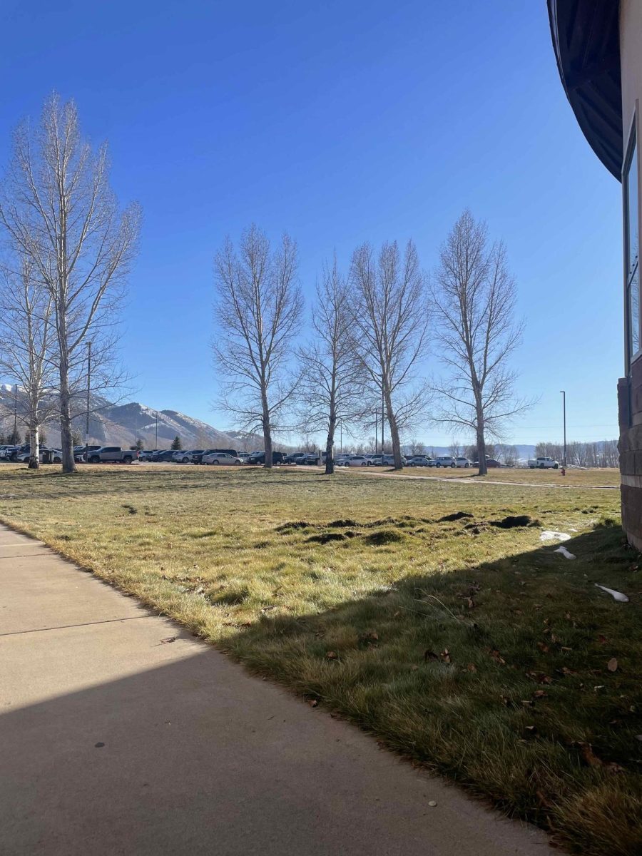 As shown in the image above taken on 12-15-25, the school grounds are really lacking snow this year. "It's sad there is no snow because we can't snowmobile or snowboard." -CJ Nuenschwander