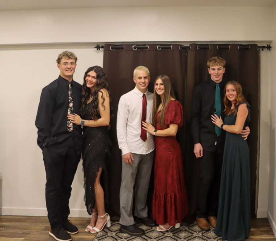 Three couples pose for a picture before the 2025 Winter Formal at Star Valley High School. Vanna Bazil said, "My favorite part of the school dances is probably when you have a good day date and then go to the dance and they have actual good music so everyone is moshing."
 