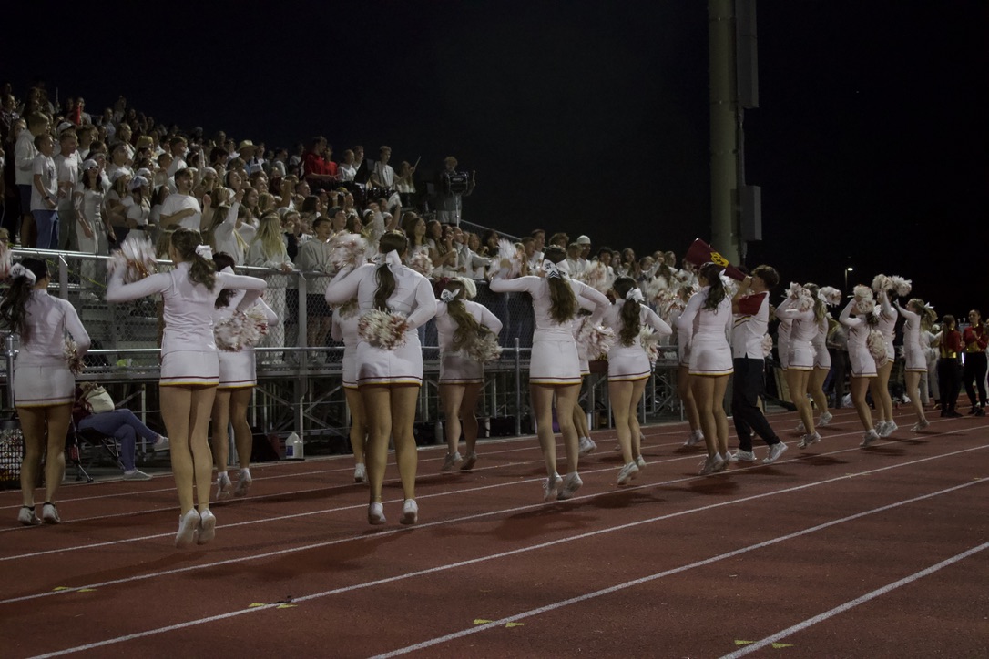 Varsity Cheer squad goes through one of their routines for the white out game this past football season. The Cheer squad continues to get ready for their state championship this upcoming weekend. Senior Italy Erickson says "We’ve been practicing a lot and really focusing on running through our routines consistently."