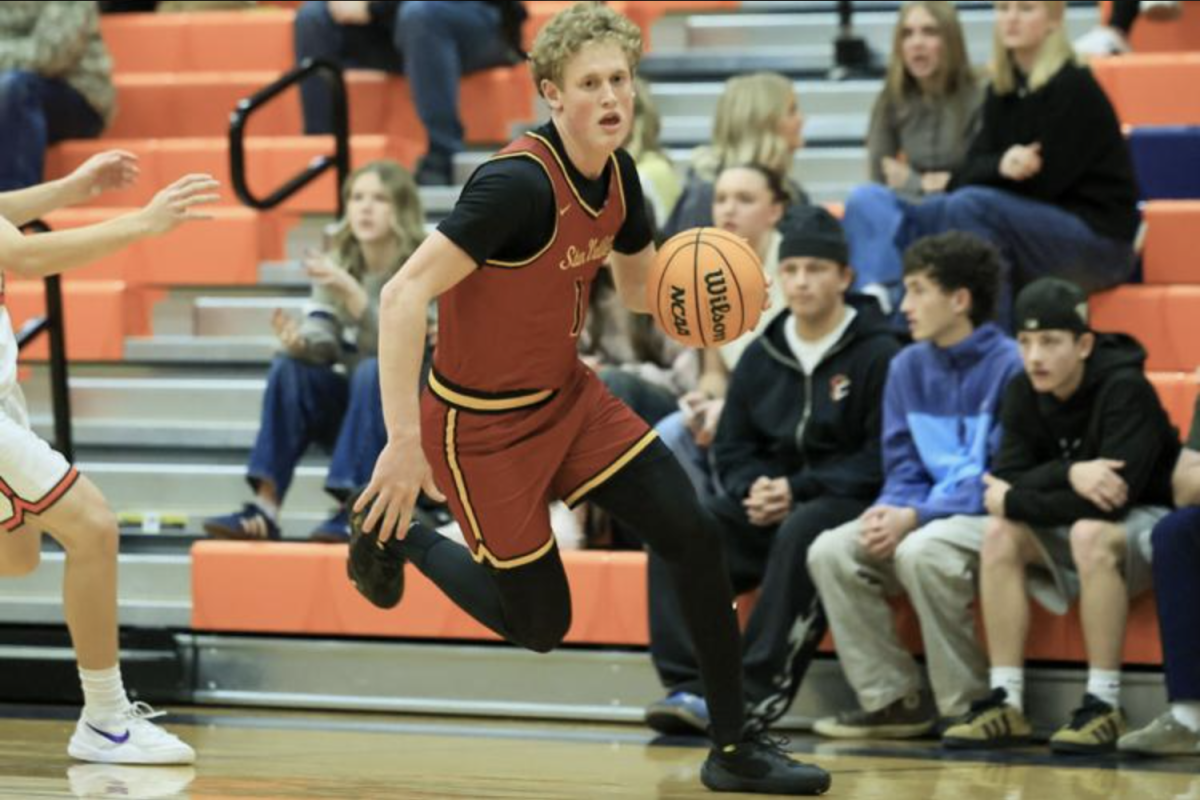 Senior Cooper Lancaster drives the ball to the basket during a heated matchup against Mountain Crest, attacking the defense with confidence and control. What fans may not know is that Lancaster is averaging 23 points per game this season, making him one of the Braves’ top scoring threats. “I think that because of our schedule that we have played so far this season, it is going to allow us to play at a higher level than our opponents. If we play together we will finish strong,” Lancaster said.