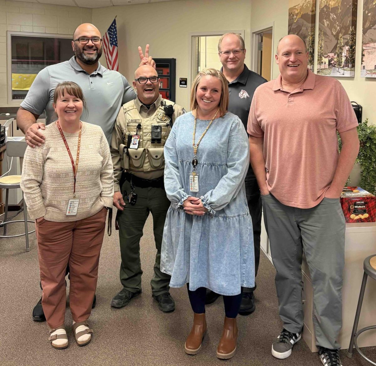 Counseling Office staff members pose together for a picture while Mr. Lesuma jokes around with Officer Bassett. We have the best Counseling Office staff. They always love to have fun, and they are so giggly! Gina Fullmer said “Correy loves us so much he would be okay to move into the hallway.”
