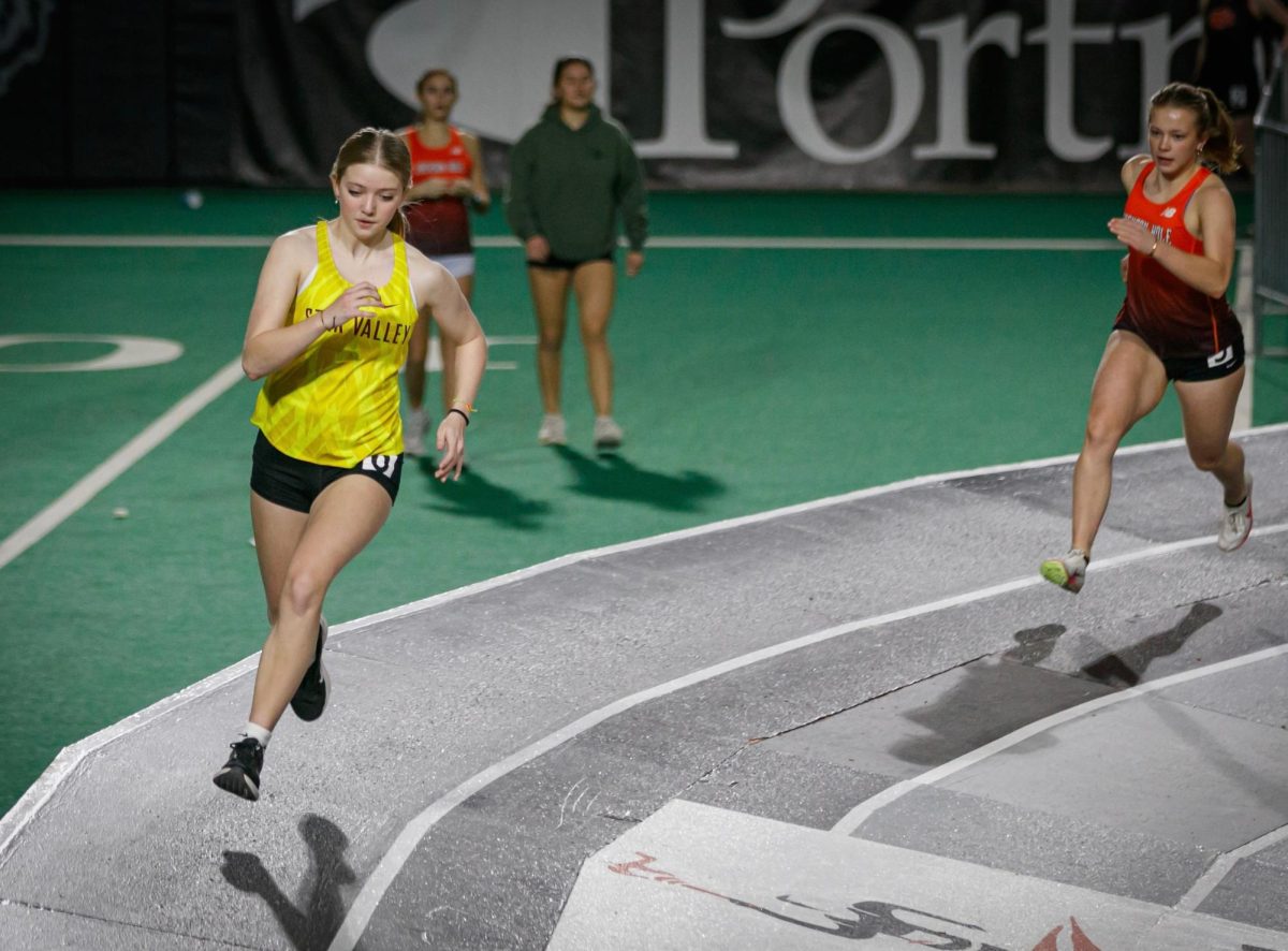 Junior Morgan King runs the 200m sprint in Idaho. King said,, “I love how close our team is. It feels more like a family than just a sport.” She has been running indoor track since her freshman year.